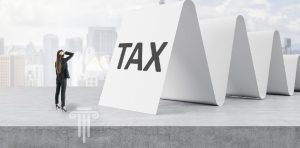 Graphic of woman staring down Taxes.